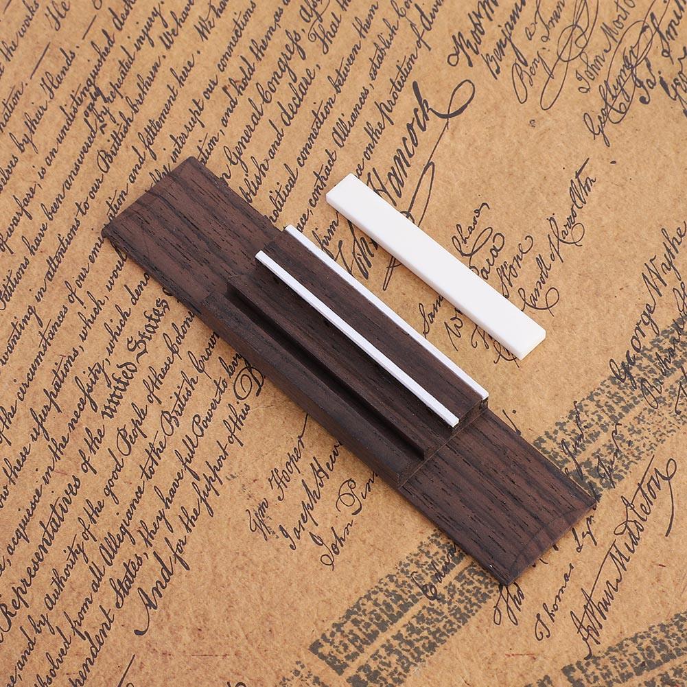 Rosewood Bridge Slotted Sattelmuttern Saiten Kit für Ukulele Ersatzteile Rosewood Bridge Slotted Sattelmuttern Saiten Kit für Ukulele Ersatzteile