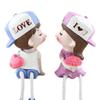"Kissing Couple Resin Figurines: Cute Hanging Feet Decorative Ornaments for Living Room or Bedroom"