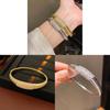 Elegant Striped Oval Bangle Bracelet With Gold Plating For Fashionable Women