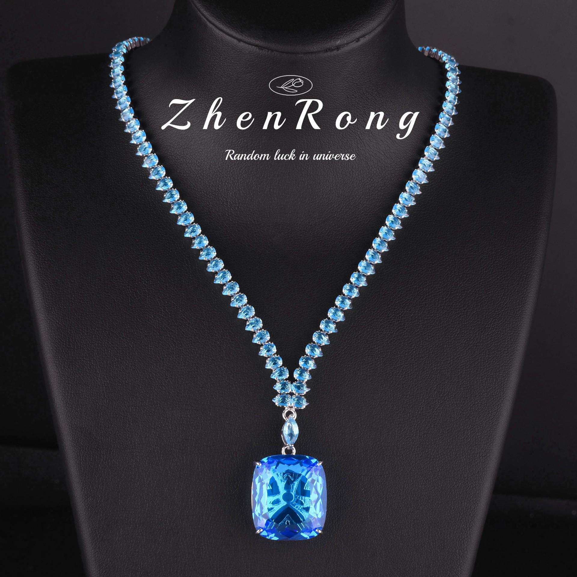 

Намисто з аквамарину та топазу 20 карат, кільце з параїбою та сережки з королівськими синьо-жовтими діамантами