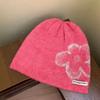 Korean version of fashionable and simple flower knitted cold hat women's winter warm atmosphere heap hat big head circumference bag head hat