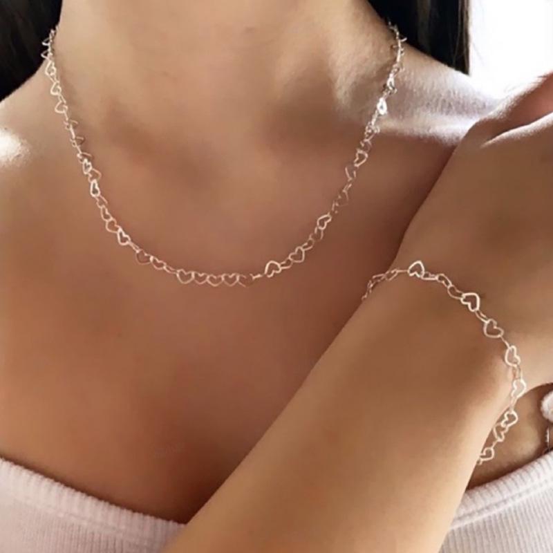 Elegant Interlocking Heart Necklace with Layered Collarbone Chain серебряный