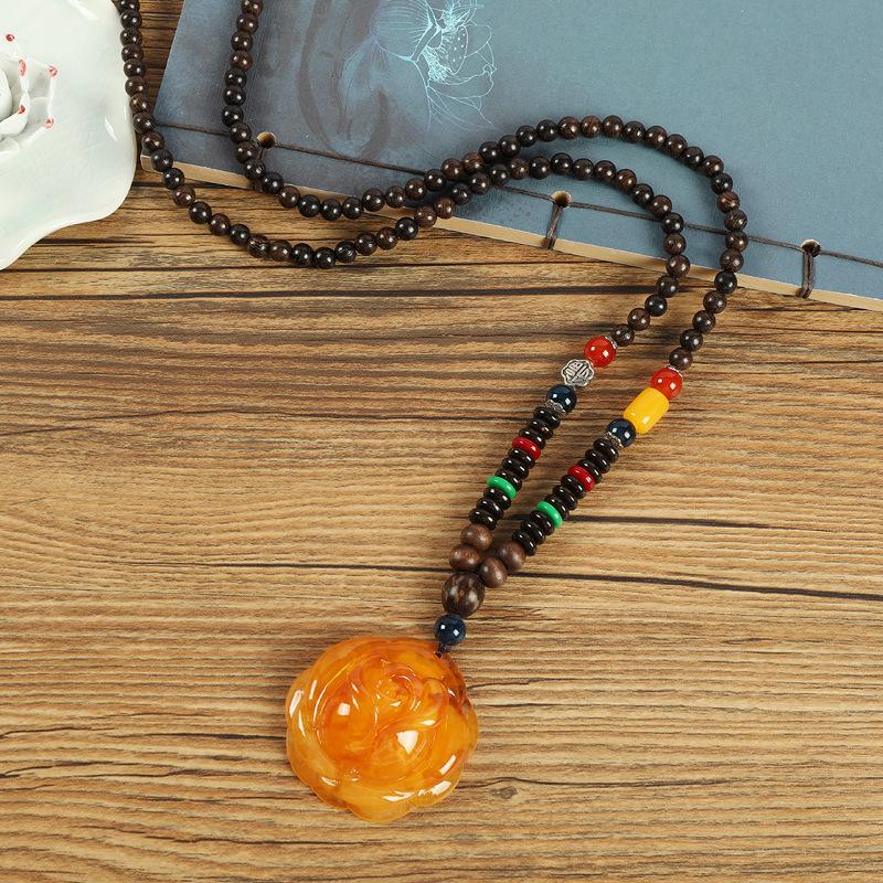 Retro chicken wing wood second generation old beeswax necklace men and women versatile amber pendant long sweater chain pendant