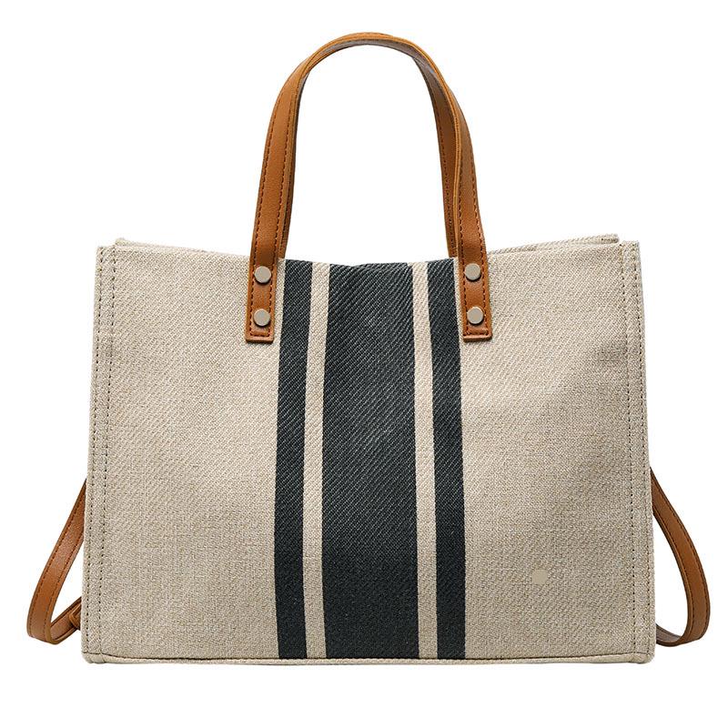 Korean-Style Striped Canvas Shoulder Bag: Women's Minimalist Professional Handbag with Large Capacity.