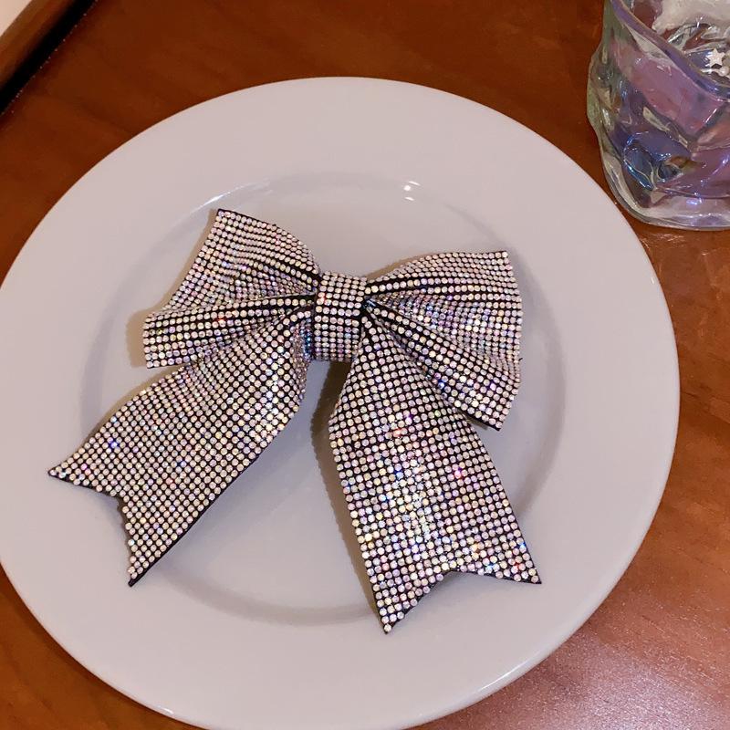 Korean version of fashion bow hairpin niche simple and versatile temperament spring clip advanced semi-drape hairpin