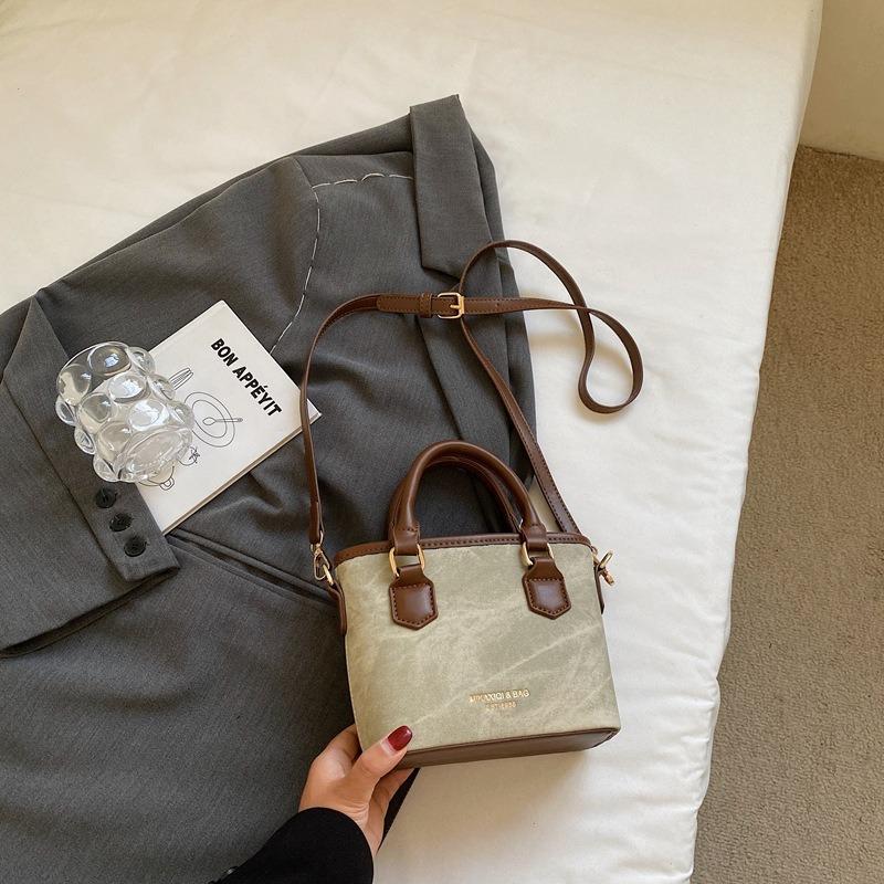 Textur trendige Nischentasche Herbst neu retro Schulter Umhängetasche Mode tragbare Eimertasche Damen