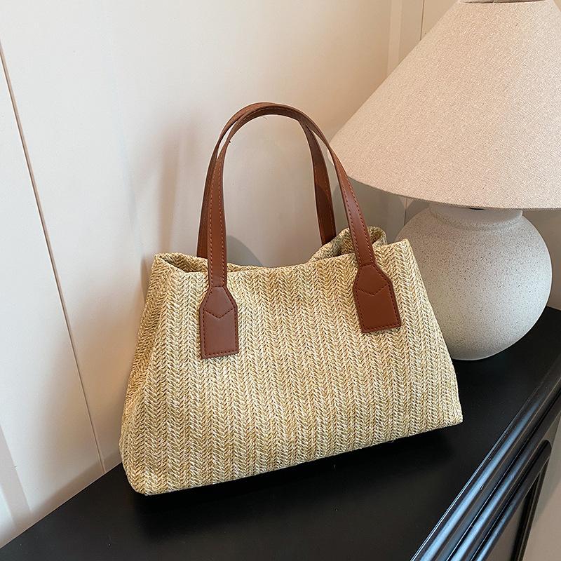 

Korean version of portable woven bag 2025 spring and summer new fashion simple tote bucket bag women s large-capacity commuter women s bag