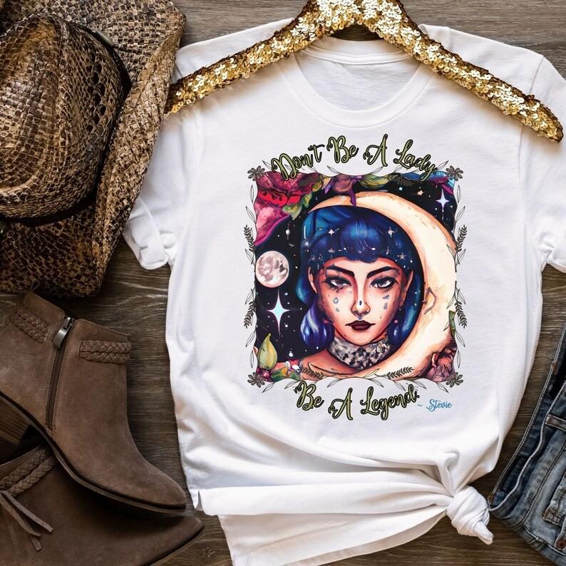 

Don039;t Be a Lady Be a Legend unisex t-shirtConcert ShirtFestival Shirt Unisex T-Shirt XL