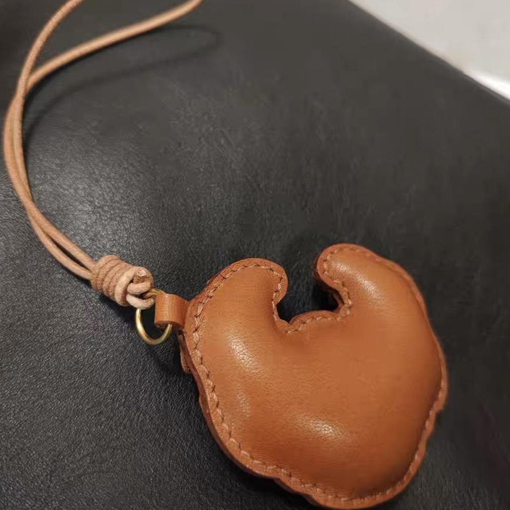 Handmade Leather Croissant Shaped Bag Charm Keychain Accessory for Fashion Enthusiasts Unique Backpack Accessories