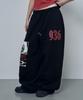 Lujeoseukeulleob Gummy Smile Club Wide Sweatpants Black