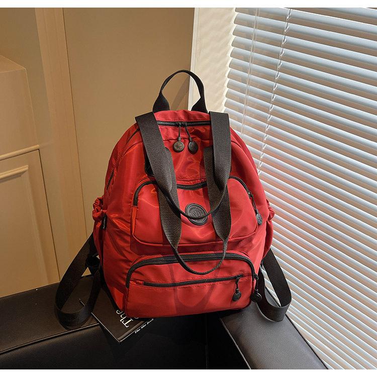 

Весна 2025 Новый Повседневный Модный Рюкзак для Путешествий Большой Вместимости Портативный Универсальный Легкий Водонепроницаемый Рюкзак красный