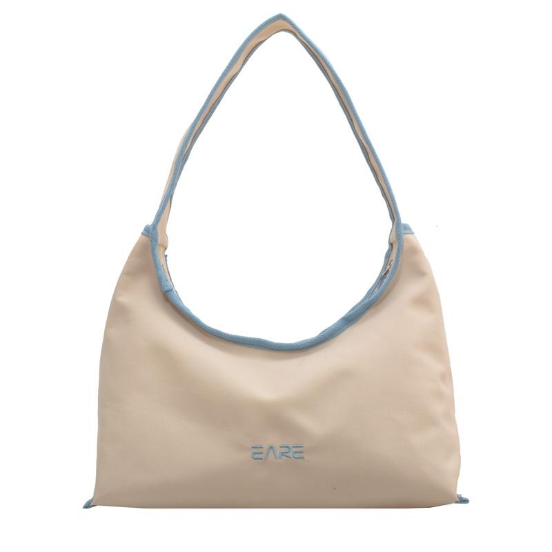 

Daily commuting large-capacity women s bags New casual versatile contrasting color shoulder bags Stylish and simple canvas underarm bags синій