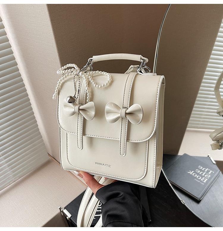 

2025 new foreign style contrasting color small backpack backpack women s summer Sen Meng women s shoulder bag Korean version portable women s bag