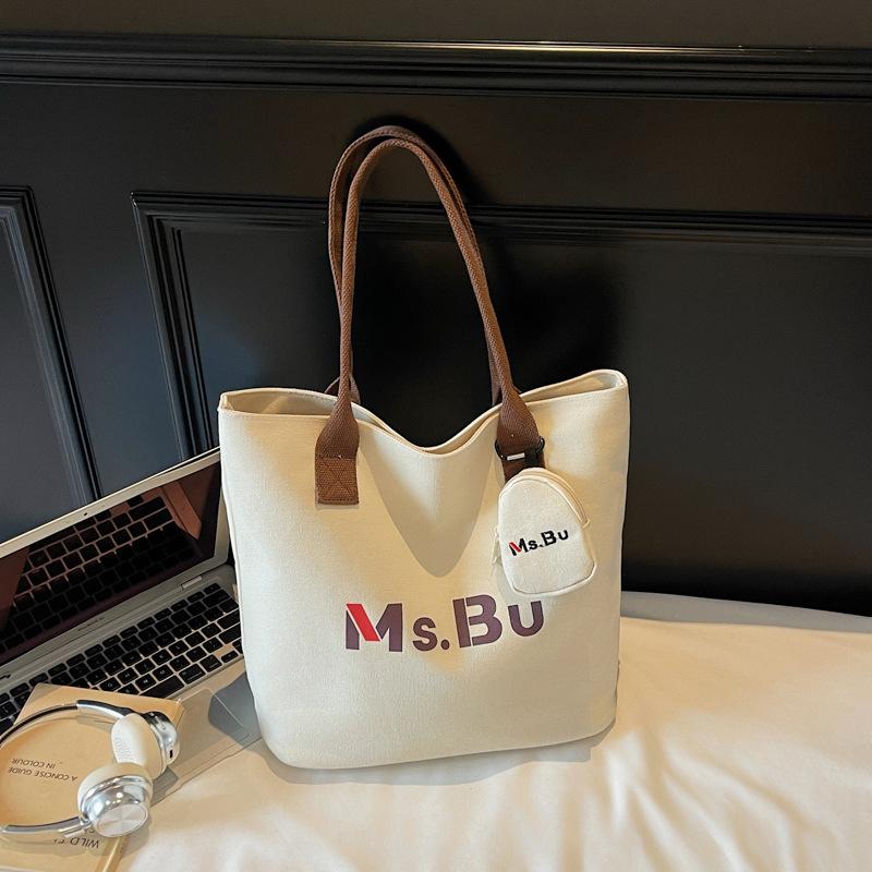 

Осень 2025 Новый нишевый дизайн Холщовая сумка с надписью Повседневная большая вместимость Легкая сумка-мессенджер для поездок на работу Сумка-тоут without pendant темно-коричневого