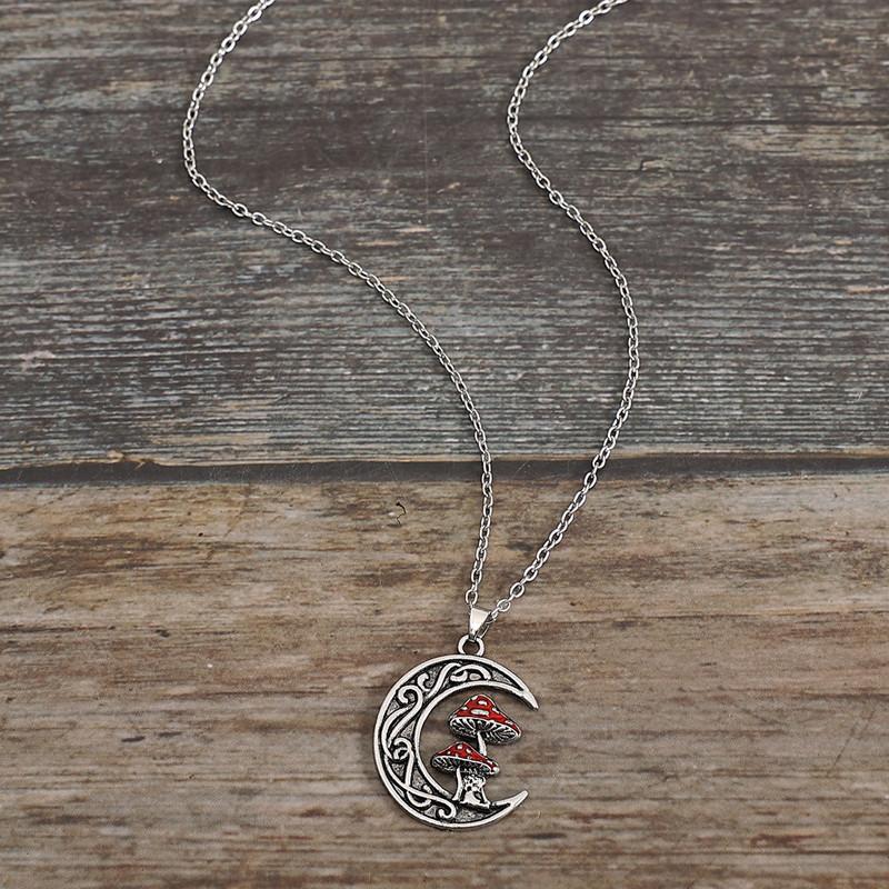 A stylish and cute red mushroom pendant necklace with a moon and a little girl design, suitable for women's everyday wear.