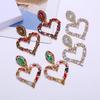 Orecchini a forma di cuore con strass europei e americani: Colorato, Vuoto, Design a Cuore d'Amore per una Dichiarazione di Moda Unica.