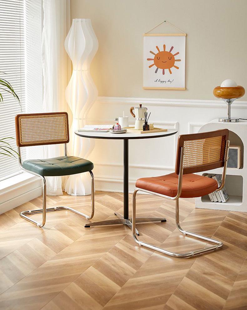 Elegantly crafted armless rattan dining chair in retro pastoral style, perfect for cafes, guesthouses, and vintage settings.