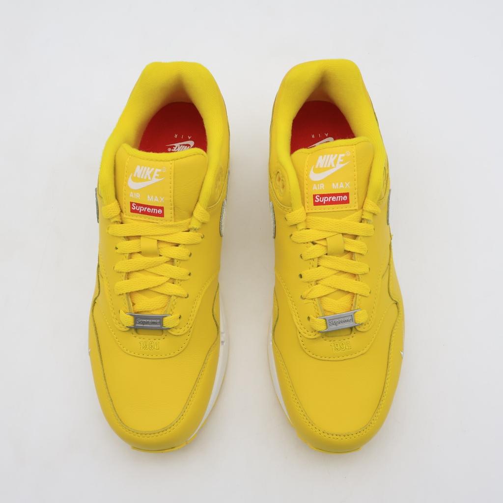 HF8813-700 Supreme Nike Air Max 1 '87 SP Amarillo SS25 Semana 4 (de los hombres)