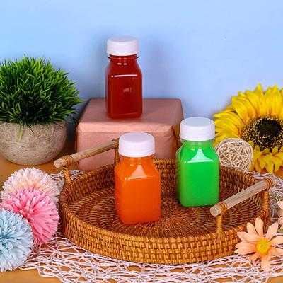 4 Stück 120 ml durchsichtige Getränkebehälter aus Kunststoff, wiederverwendbare leere Saftflaschen mit schwarzen manipulationssicheren Deckeln für Saft, Milch, Kaffee