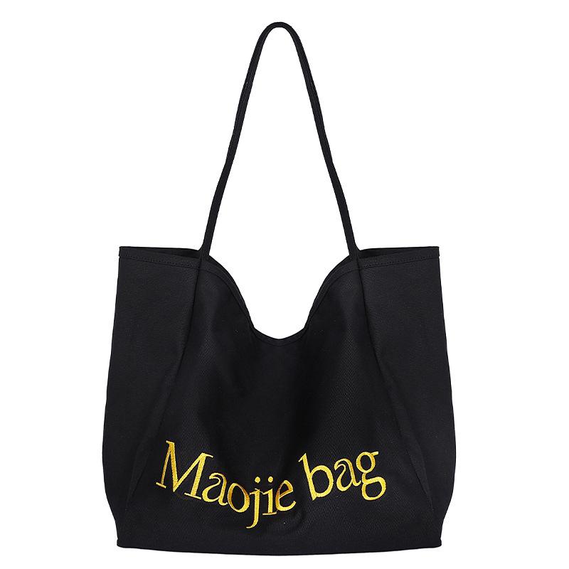 Large-capacity canvas bag, new niche versatile casual class commuting portable shoulder tote bag
