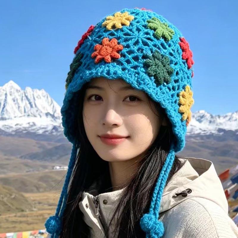 Handmade crocheted ear protection hat women's autumn and winter ethnic style colored flower knitted hat fringed strap ball bag head wool hat