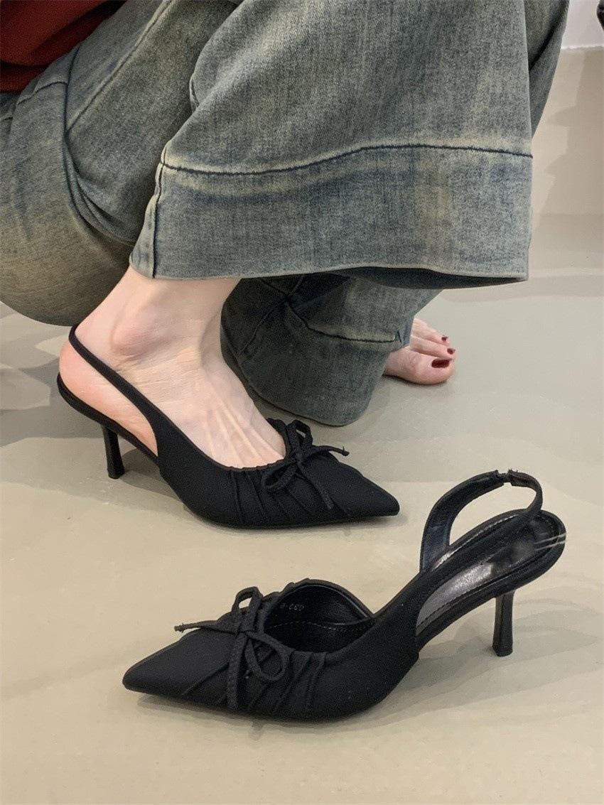 

Французские нишевые темпераментные высокие каблуки женские 2025 весна бант заостренный нос неглубокий нос тонкий каблук сандалии мешок головка 40 чёрный