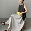 A Long Sleeveless Dress with A Vest Skirt