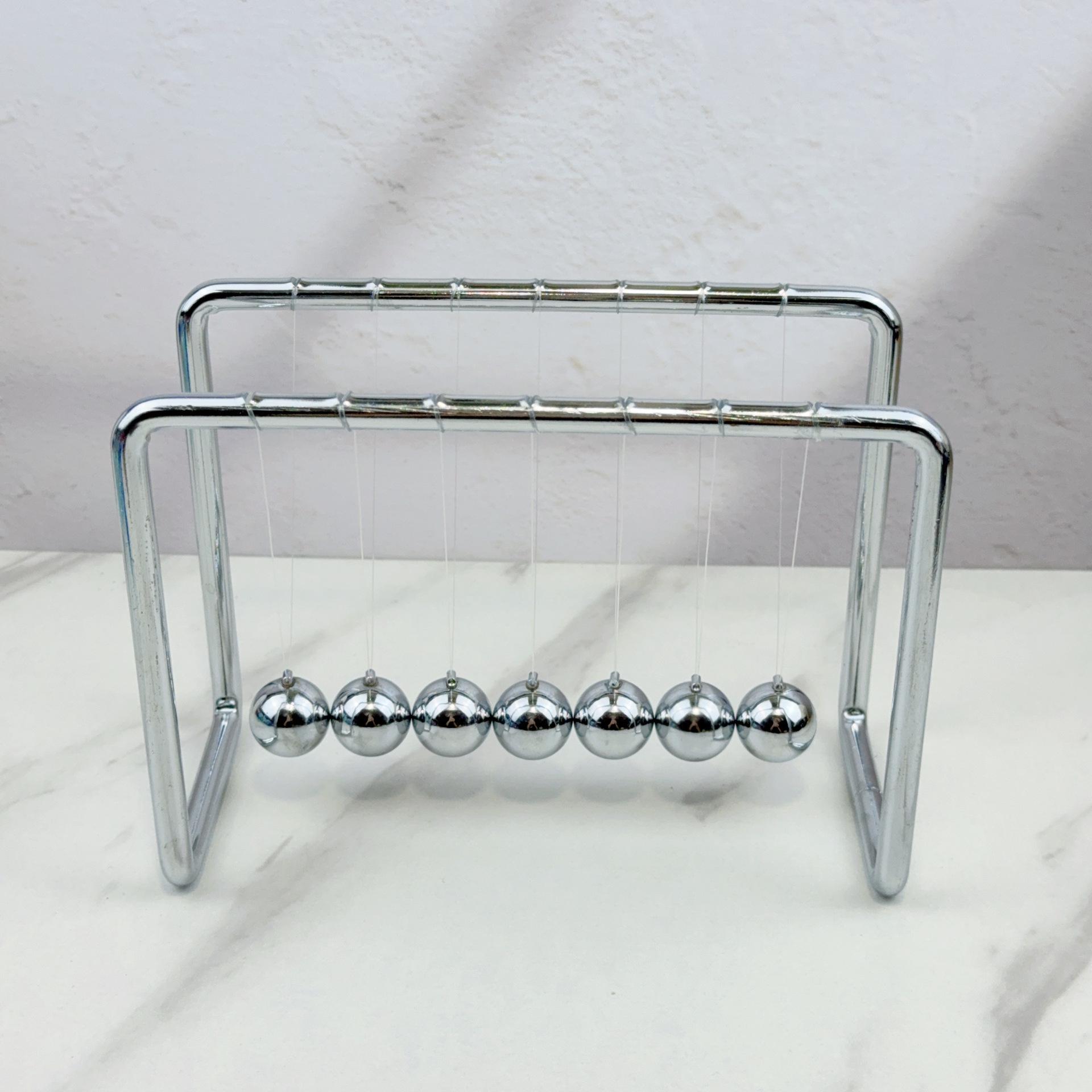 

Металлический маятник Ньютона с 7 шарами - Креативное антистрессовое изделие ручной работы