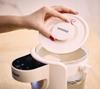 Machine for preparing formula milk for babies