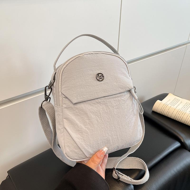 New nylon cloth mini mobile phone bag, female trendy small bag, light portable, simple and fashionable shoulder messenger bag.