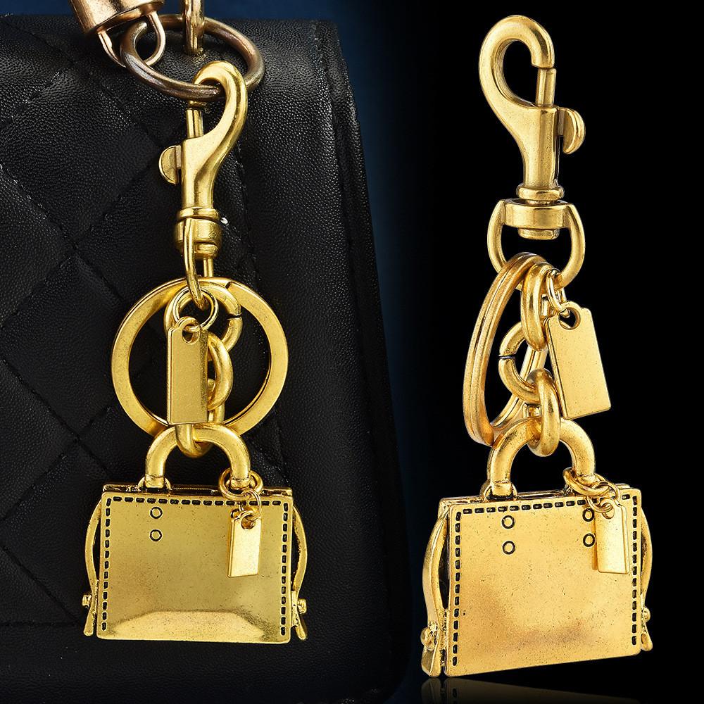 Metallischer Schlüsselanhänger Taschenanhänger Mit Graviertem Buchmuster Für Modeaccessoires
