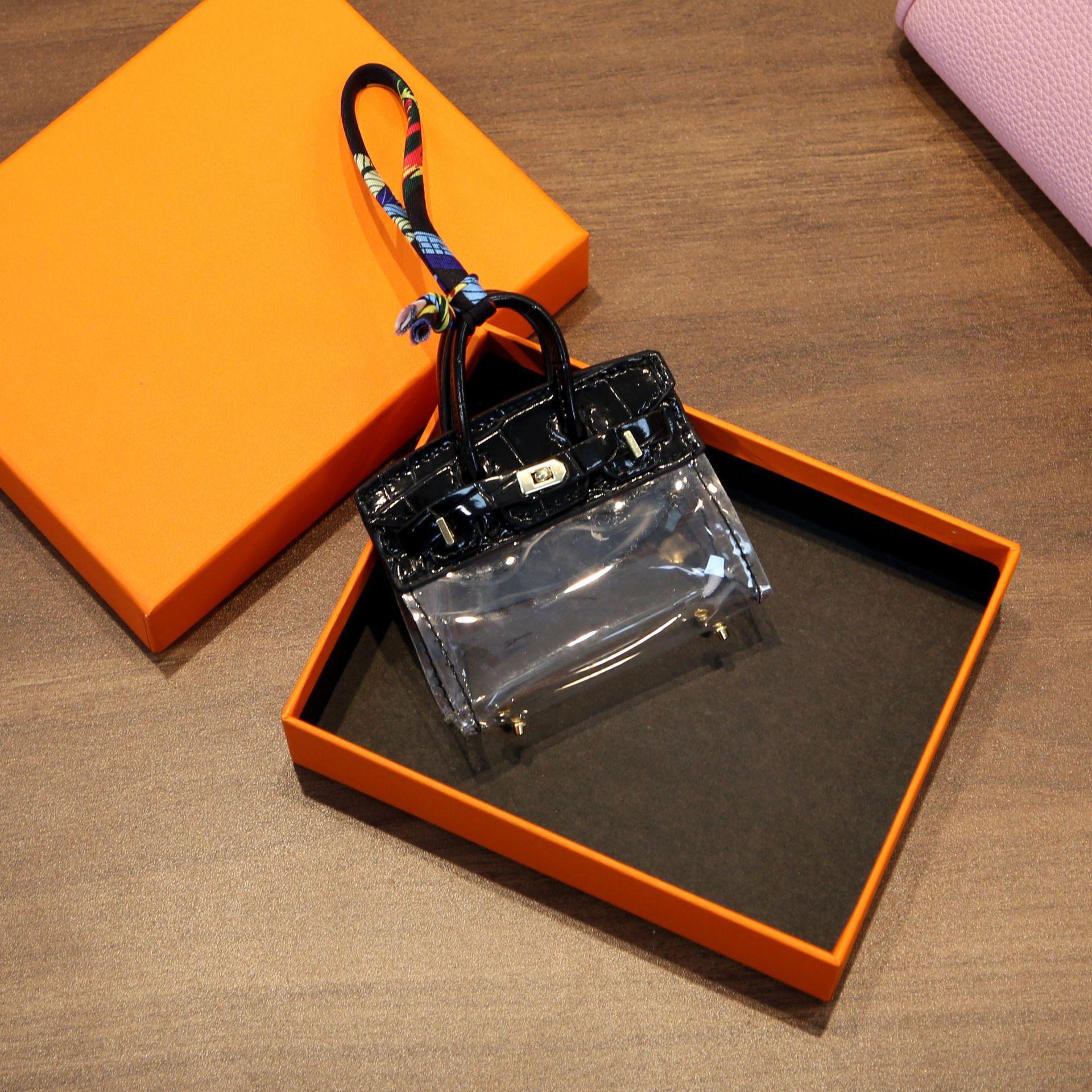 

Интернет-сумка для ключей знаменитости Прозрачная платиновая сумка Мини-подвеска Наушники Помада Ключи от машины Нулевой кошелек Автомобильные аксессуары для женщин 8.5x3x10cm чёрный