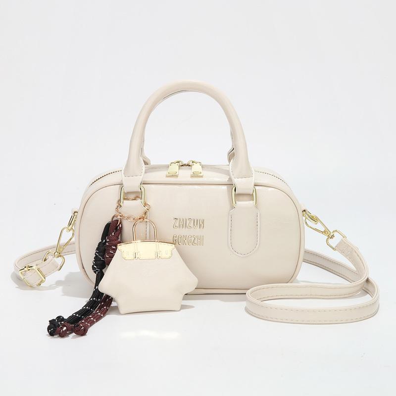 

Популярная в этом году женская сумка-боулинг 2025 новая сумка-мессенджер для работы с ощущением высокого класса, портативная наплечная сумка для женщин бежевый