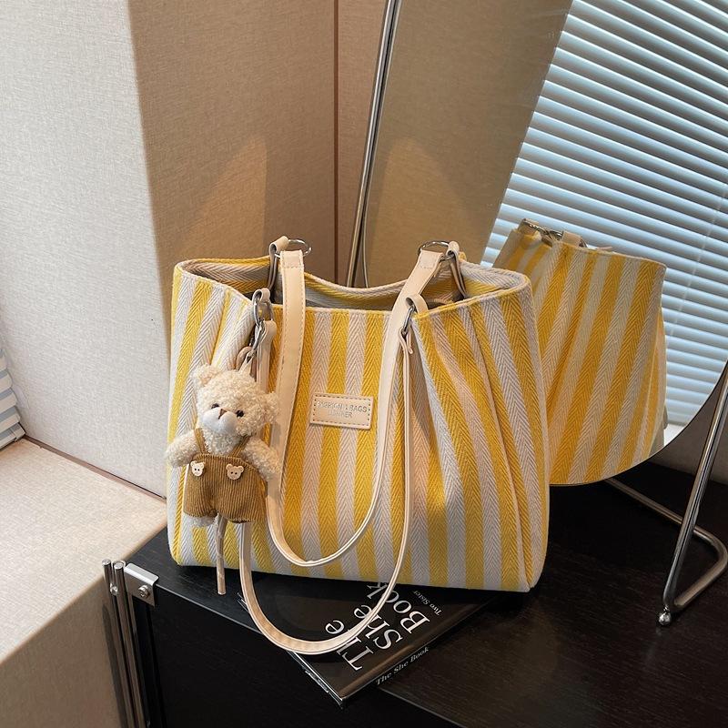 Niche fashion striped large-capacity commuter bag women's new versatile shoulder bag portable tote bag