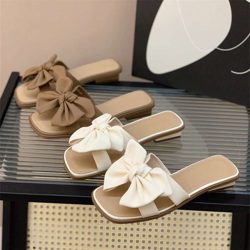 Low-heeled bow one-word drag women's summer wear flat-bottomed square-head slippers 2025 new seaside beach shoes