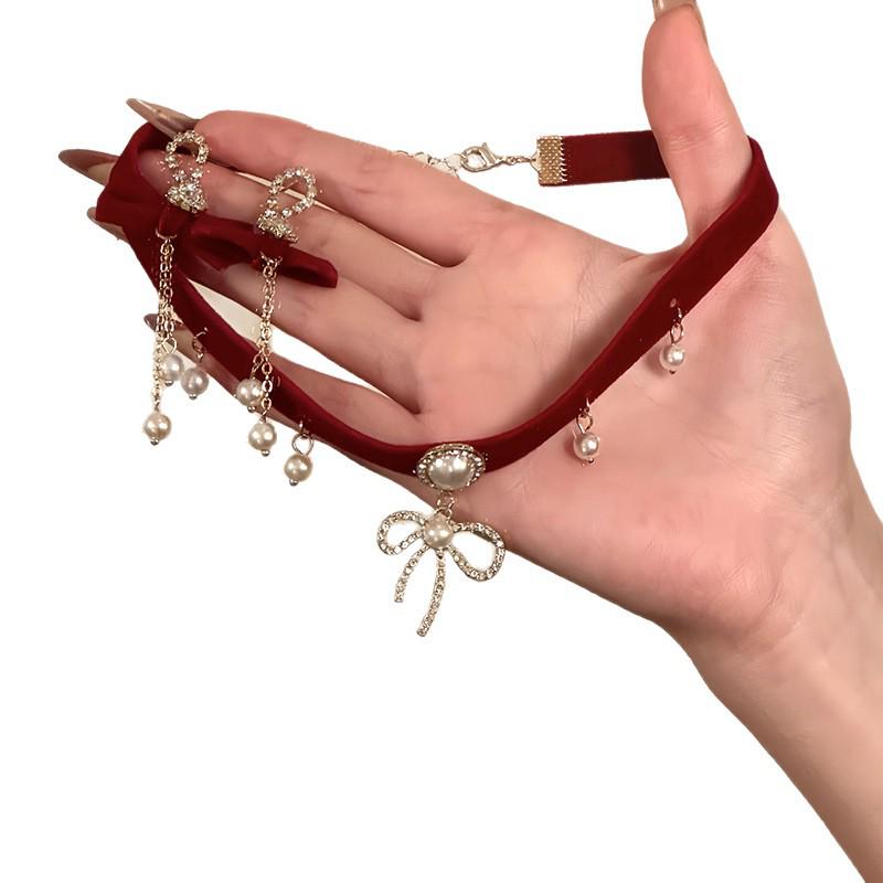 Elegant Pearl Necklace with Diamond-Studded Bow Pendant - Unique Design for Women