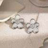 European and American exaggerated personality pleated texture flower titanium steel stud earrings, retro design sense gold five-petaled flower 