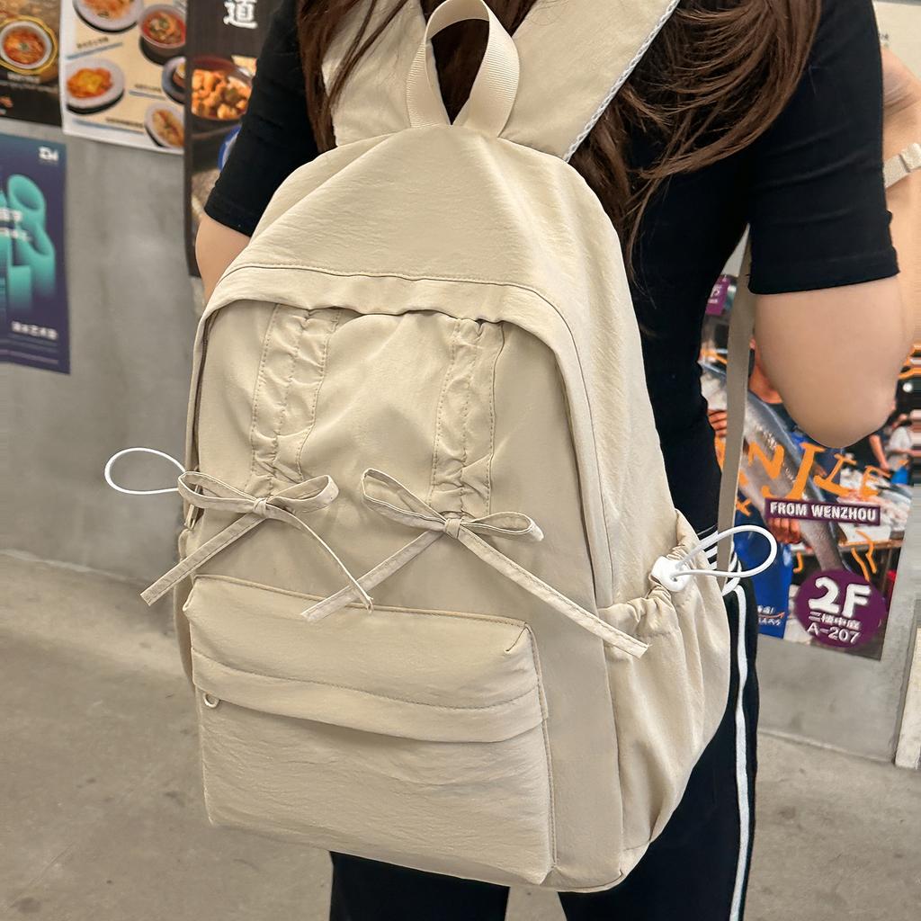 Schoolbag schoolbag female student college student pleated drawstring bow design sense going out backpack backpack female travel lightweight