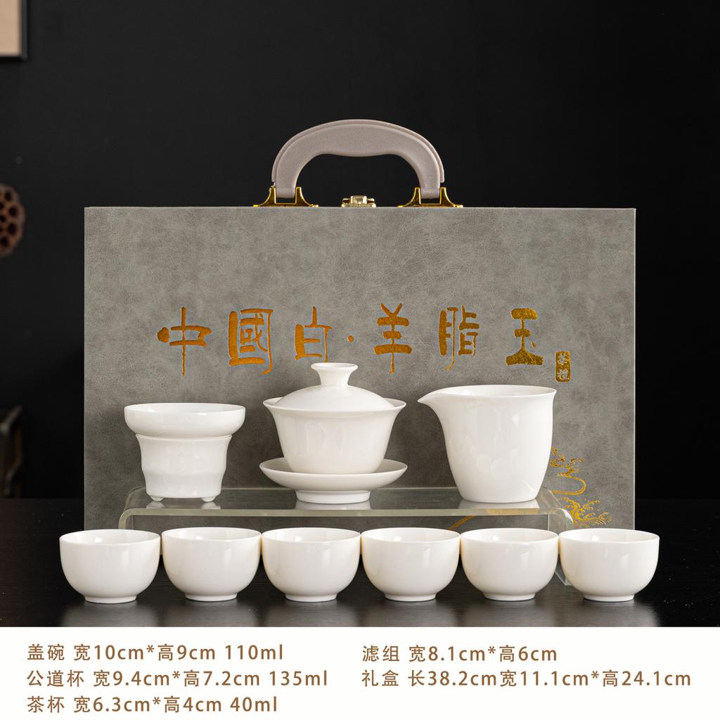 Dehua suet jade porcelain tea set is a complete set of gold-painted white porcelain household tea making utensils Company