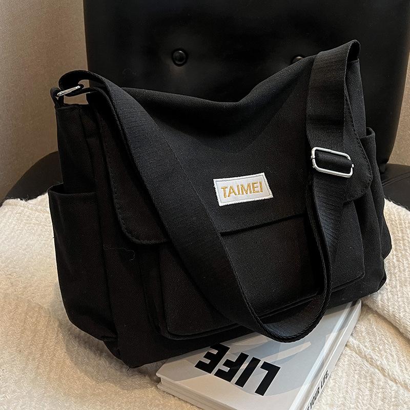 

Women s Bag Solid Color Postman Bag Versatile High End Commuting Bag Niche One Shoulder Crossbody Bag