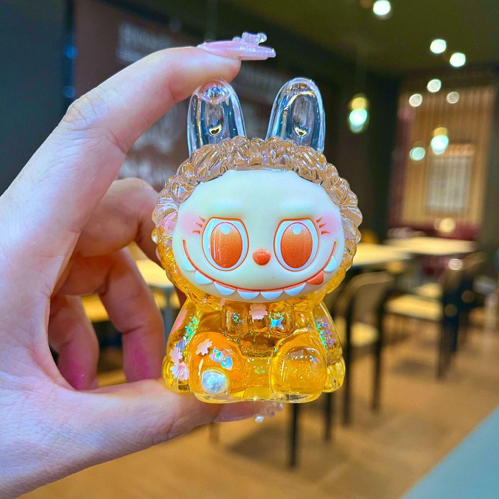 Kurutulmuş Çiçekler, Yanıp Sönen Renkli Boncuklar ve Yağ Şişesi ile Mengmeng Tavşan Hareketli Kum Süsleri - Sevimli Tahıl Aksesuarları ve Douyin'de Trend Oyuncaklar.