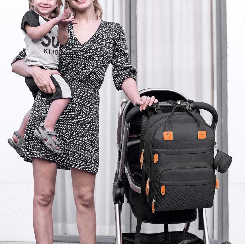 Foldable Waterproof Mommy Backpack with Bed - Multifunctional Large Capacity for Mother and Baby.