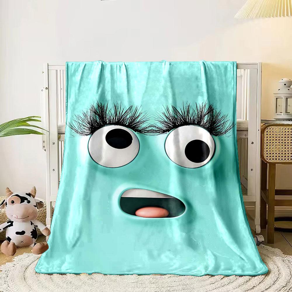 

A playful turquoise face with large eyes, long lashes, and an open mouth. for all seasons blanket lunch break throw gift 80cm x 120cm