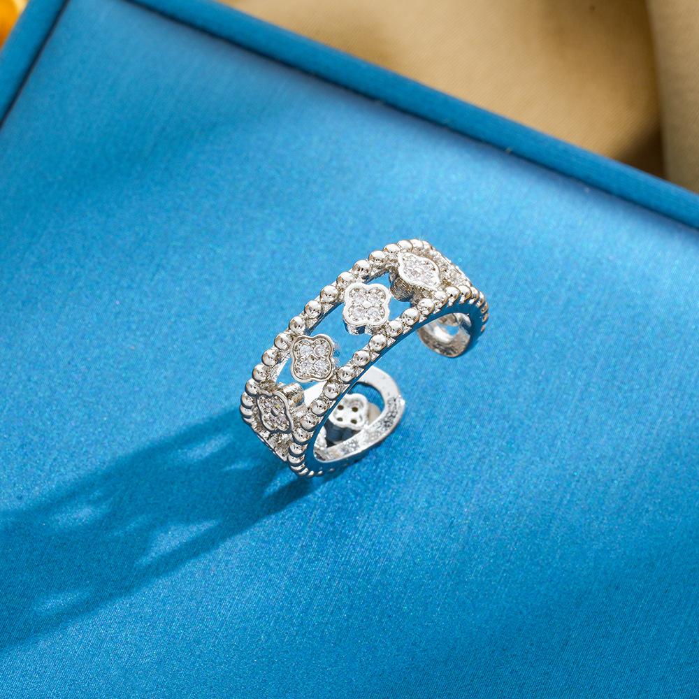 

Vintage style diamond hollow out four leaf clover zircon open ring, with a niche design and personality