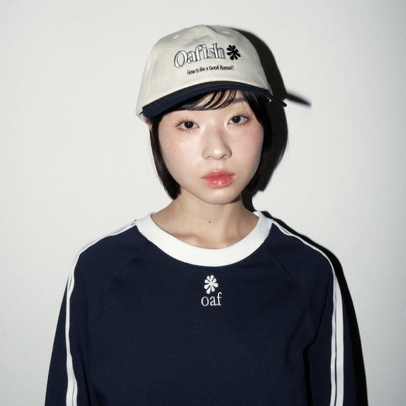 

Oafish Leather strap Cap, Ivory/Navy Free