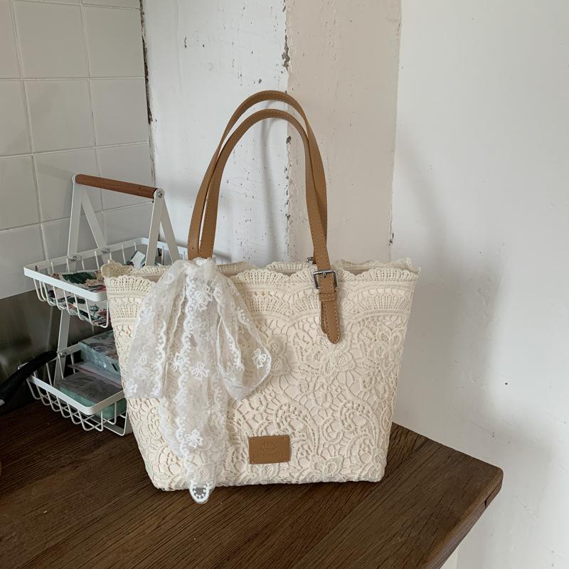 Niche large-capacity woven bag tote bag autumn new hollow lazy wind shoulder armpit bag beach bag