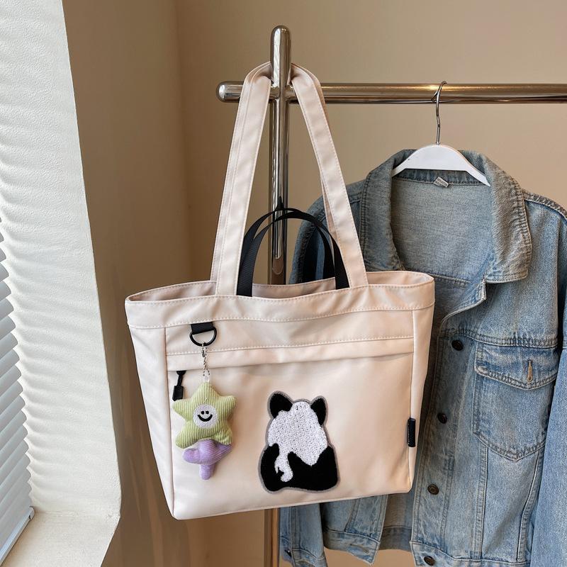 Spring canvas large-capacity messenger bag for women 2025 new trendy cartoon panda print shoulder tote handbag for women