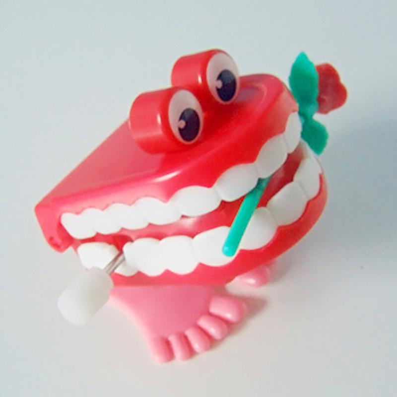 1pcs Clockwork Toy Upper Chain Jumping Tooth Toy Children Jump Teeth Running Clockwork Spring Wind Up Toy