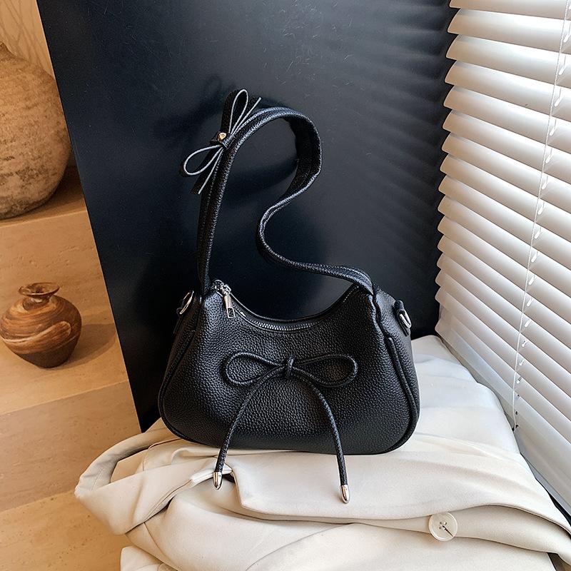 Fashion casual bow shoulder bag new high value sense crossbody armpit dumpling bag