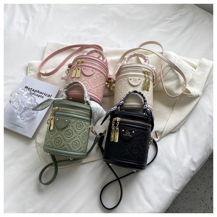 Autumn 2024 Trendy Women's Round Bucket Crossbody Bag: Solid Color, Textured, Hand-Held, and Stylish.